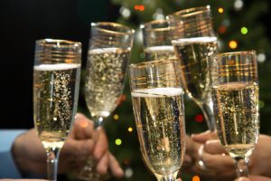 People hands with crystal glasses full of champagne